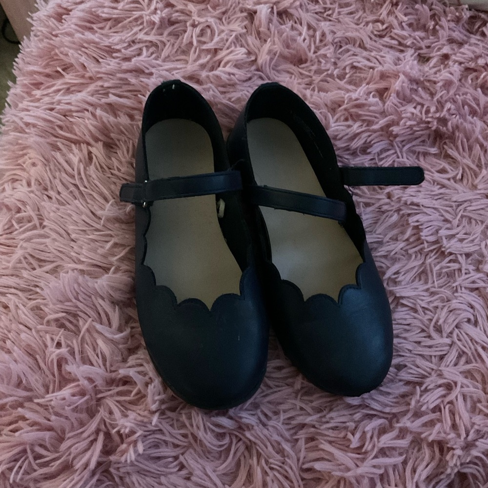Children place school shoes